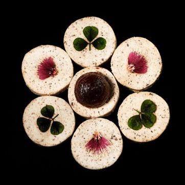 Baigan Bharta - charred eggplants in tandoor, freeze dried and then compressed to cookies sandwiched with onion chutney. (Gaggan/Facebook)