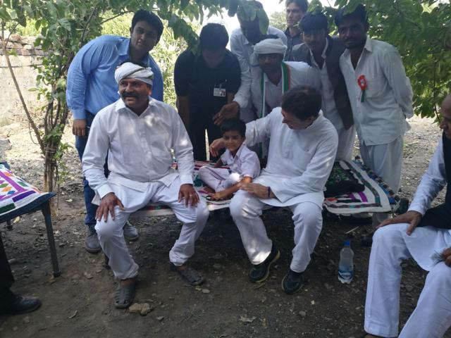 Rahul Gandhi sits with a family at Hanjrapar village on Monday during the first day of his Navsarjan Yatra. (HT Photo) Rahul Gandhi sits with a family at Hanjrapar village on Monday during the first day of his Navsarjan Yatra. (HT Photo)