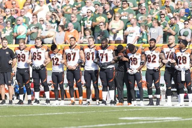 The Cincinnati Bengals lock arms during the national anthem prior to the game against the Green Bay Packers. (USA TODAY)