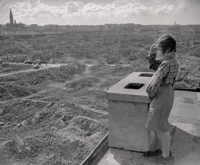 April 3, 1946, Warsaw: A Polish girl surveys the ruins of Warsaw's ghetto, where Jews were ruthlessly murdered. An estimated 50,000 bodies lie under those ruins. (© Bettmann/CORBIS) April 3, 1946, Warsaw: A Polish girl surveys the ruins of Warsaw's ghetto, where Jews were ruthlessly murdered. An estimated 50,000 bodies lie under those ruins. (© Bettmann/CORBIS)