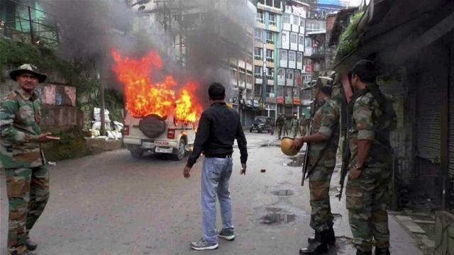A vehicle in flames after it was set on fire by protesters in Darjeeling in June this year. (PTI Photo) A vehicle in flames after it was set on fire by protesters in Darjeeling in June this year. (PTI Photo)