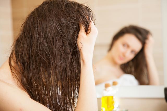 For the hair, simply run anti-frizz serum like avocado carrier oil through your tresses and braid them. (Shutterstock)