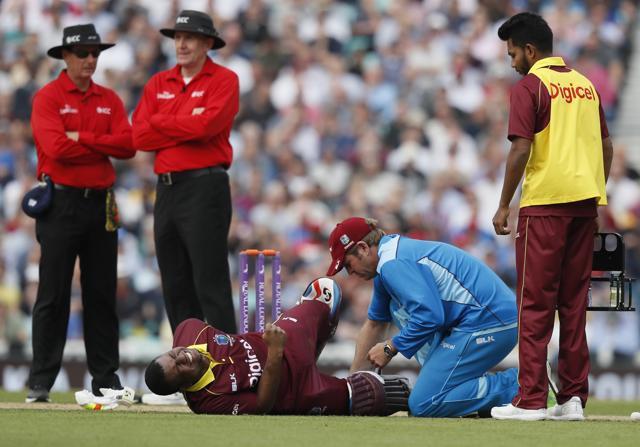 West Indies' Evin Lewis receives medical attention after getting hit by the ball . (AP) West Indies' Evin Lewis receives medical attention after getting hit by the ball . (AP)