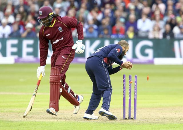 West Indies batsman Chris Gayle narrowly avoids being run out by England's Moeen Ali during the third one day international cricket match at the Brightside Ground in Bristol on September 24, 2017. (AFP) West Indies batsman Chris Gayle narrowly avoids being run out by England's Moeen Ali during the third one day international cricket match at the Brightside Ground in Bristol on September 24, 2017. (AFP)