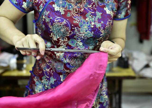 One of craftsman Lin Chin-te's students, tailoring a cloth at Lin's studio in Taipei. (AFP) One of craftsman Lin Chin-te's students, tailoring a cloth at Lin's studio in Taipei. (AFP)