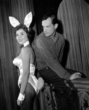 FILE - In this June 20, 1961 file photo, Playboy magazine publisher Hugh Hefner poses with "bunny-girl" hostess Bonnie J Halpin at Hefner's nightclub in Chicago. (AP File Photo) FILE - In this June 20, 1961 file photo, Playboy magazine publisher Hugh Hefner poses with "bunny-girl" hostess Bonnie J Halpin at Hefner's nightclub in Chicago. (AP File Photo)