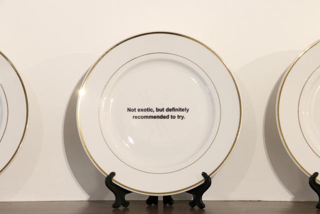 Reviews from some restaurants are embossed on a set of plates. Reviews from some restaurants are embossed on a set of plates.