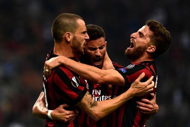AC Milan's Argentinian defender Mateo Musacchio (C) celebrates with teammates Christian Bonucci (L) and Fabio Borini (R) after scoring during the UEFA Europa League football match between AC Milan and HNK Rijeka. (AFP) AC Milan's Argentinian defender Mateo Musacchio (C) celebrates with teammates Christian Bonucci (L) and Fabio Borini (R) after scoring during the UEFA Europa League football match between AC Milan and HNK Rijeka. (AFP)