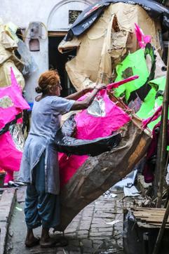 A woman puts together a Ravana head using bamboo and paper. The full-size effigies can range upwards of 50 feet. (Mohit Suneja / HT Photo)