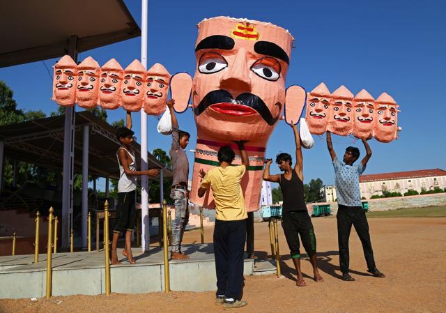 Workers often accompany the customised effigies to their customers across states, ensuring that they are properly set-up and installed. (Himanshu Sharma / REUTERS)