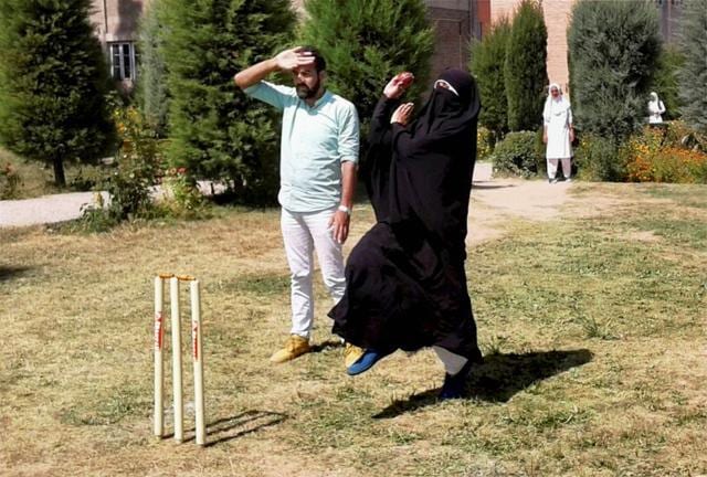 A woman cricketer in Baramulla defying social restrictions in her passion for the sport. (PTI) A woman cricketer in Baramulla defying social restrictions in her passion for the sport. (PTI)