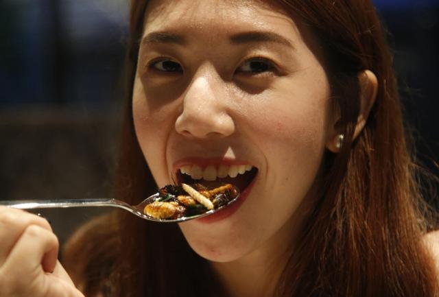 Kelvarin Chotvichit eats bamboo worms, silkworm and crickets at Insects in the Backyard. (AP) Kelvarin Chotvichit eats bamboo worms, silkworm and crickets at Insects in the Backyard. (AP)