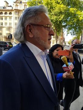 Vijay Mallya talks to reporters as he leaves the Westminster Magistrates’ Court in London on October 3, 2017. (HT Photo)