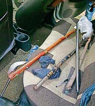 Weapons recovered from the damaged car belonging to the gangsters, at the crime spot near Shivalik Enclave in Kharar on Monday. (HT Photo)