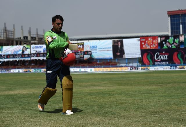 In this photograph taken on September 14, 2017 Rashid Khan, Afghan national team cricket player, walks during the Shpageeza Cricket League T20 tournament at the Kabul International Cricket ground in Kabul. (AFP)