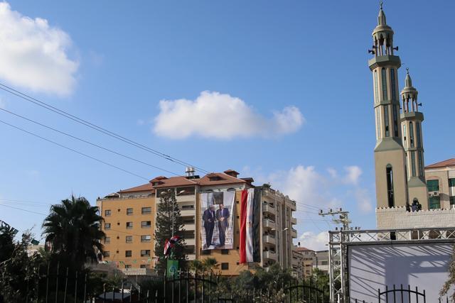 A banner bearing a photograph of Palestinian leader Mahmud Abbas and Egyptian President Abdel Fattah al-Sisi hangs on the facade of the Palestinian government's headquarters in Gaza City on October 3, 2017. (AFP)