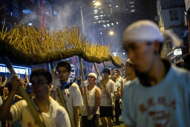 The tradition is said to have started after the once sleepy coastal village was hit by a typhoon, followed by a plague. (AFP) The tradition is said to have started after the once sleepy coastal village was hit by a typhoon, followed by a plague. (AFP)