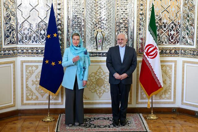 Mohammad Javad Zarif and Federica Mogherini pose prior to a round of talks, in Tehran, Iran. (AP File Photo)