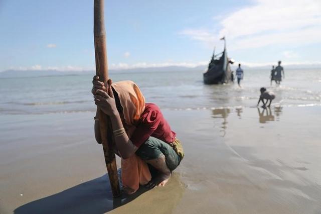 File photo of a woman collapsing from exhaustion as Rohingya refugees arrive by a wooden boat from Myanmar to the shore of Shah Porir Dwip in Teknaf, near Cox's Bazar, in Bangladesh on October 1, 2017. (Reuters) File photo of a woman collapsing from exhaustion as Rohingya refugees arrive by a wooden boat from Myanmar to the shore of Shah Porir Dwip in Teknaf, near Cox's Bazar, in Bangladesh on October 1, 2017. (Reuters)