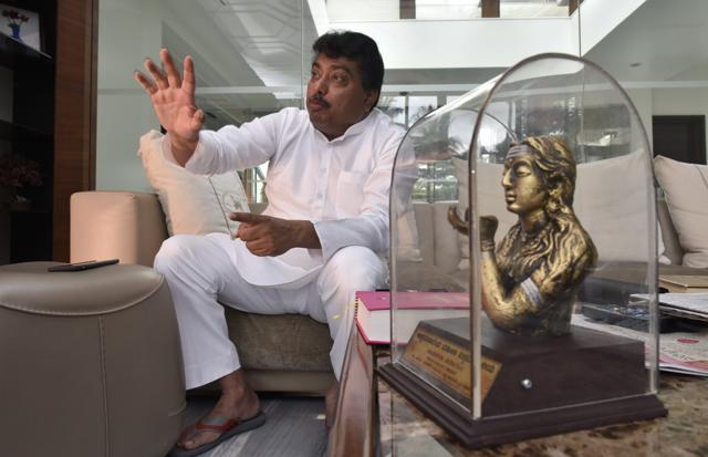 MB Patil, a Lingayat, is a minister in the government of Karnataka. He is active in the campaign for a separate religion. To his right is a statuette of Akkamahadevi, a Vachana poet and follower of Basavanna. (Arijit Sen/HT Photo) MB Patil, a Lingayat, is a minister in the government of Karnataka. He is active in the campaign for a separate religion. To his right is a statuette of Akkamahadevi, a Vachana poet and follower of Basavanna. (Arijit Sen/HT Photo)