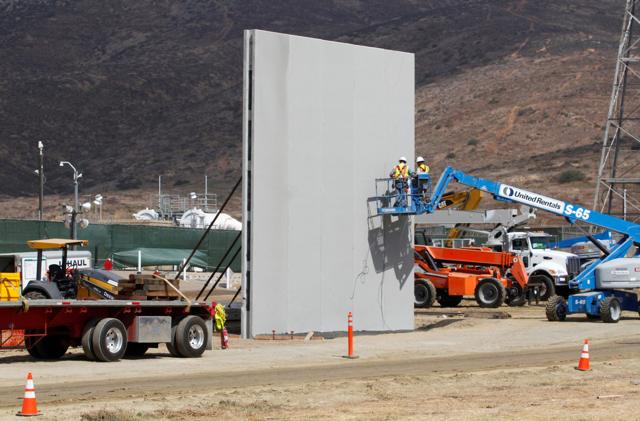 People work in San Diego, California, U.S., at the construction site of prototypes for U.S. President Donald Trump's border wall with Mexico, in this picture taken from the Mexican side of the border in Tijuana, Mexico October 3, 2017. REUTERS/Jorge Duenes TPX IMAGES OF THE DAY (REUTERS)