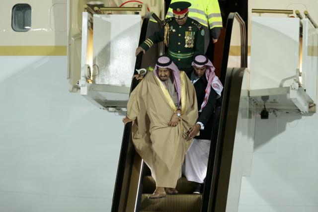 Saudi King Salman walks down the escalator of his plane upon arrival in Moscow's Government Vnukovo airport, Russia. (AP)