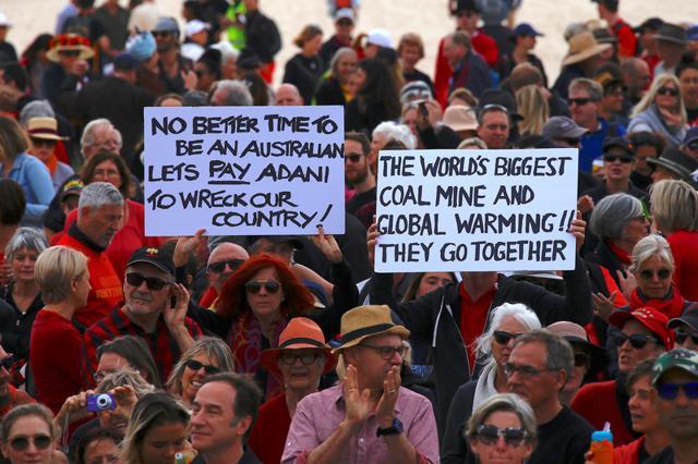 Protesters hold signs as they participate in a national Day of Action. (Reuters Photo) Protesters hold signs as they participate in a national Day of Action. (Reuters Photo)