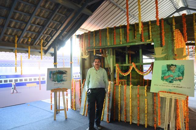 Pankajbhai Modi, brother of Prime Minister Narendra Modi, poses besides the former tea stall of father Damodardas Mulchand Modi, at the railway station in Vadnagar, some 110kms from Ahmedabad. (AFP Photo)
