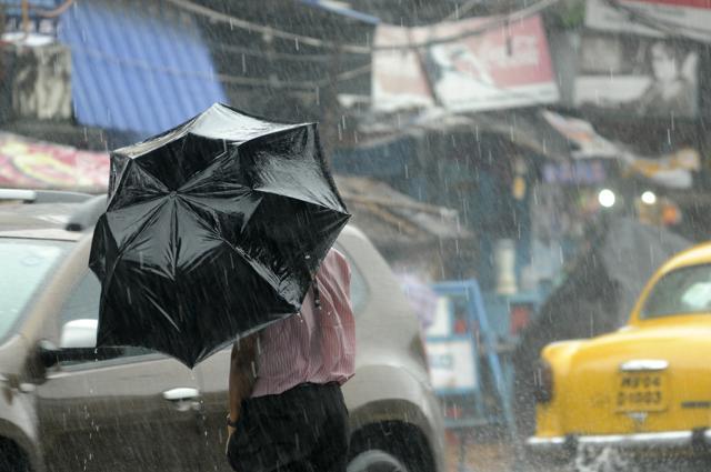 Umbrellas were of little use the rains were accompanied by strong gusts of wind. (Samir Jana) Umbrellas were of little use the rains were accompanied by strong gusts of wind. (Samir Jana)