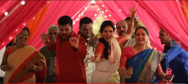 Actor-model Ashwathy Warrier and Abilash Unnikrishnan grooving to ‘I’m Mallu’ song in their wedding video (Screengrab/Youtube)