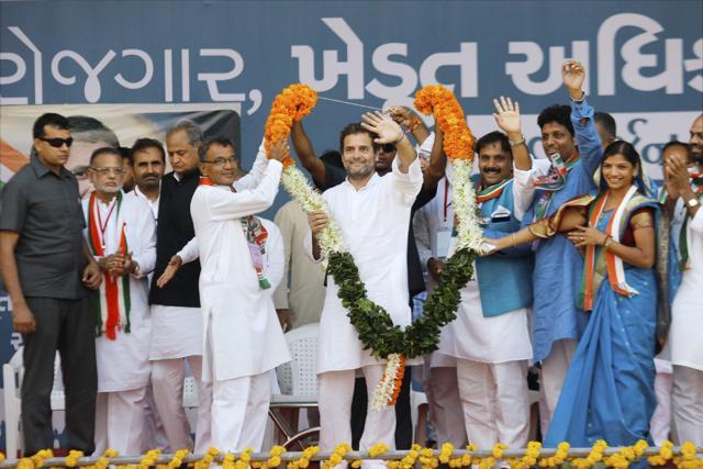 Congress party vice president Rahul Gandhi presented with a garland during a public meeting at Bodeli in Gujarat’s Chhota Udaipur district on Tuesday. (PTI Photo) Congress party vice president Rahul Gandhi presented with a garland during a public meeting at Bodeli in Gujarat’s Chhota Udaipur district on Tuesday. (PTI Photo)