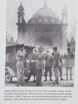 An image at the exhibition showing Indian soldiers drinking tea from a mobile canteen outside the Shah Jahan Mosque in Surrey in 1941. (HT Photo)