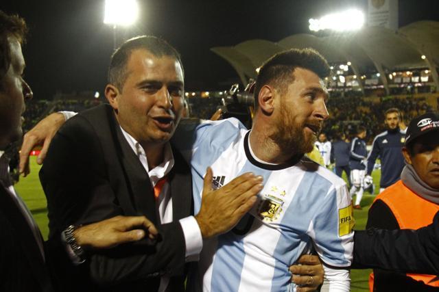 Argentina's Lionel Messi (R) celebrates after defeating Ecuador and qualifying to the 2018 World Cup football tournament, in Quito, on October 10, 2017. (AFP)