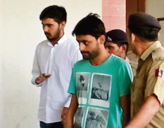 Accused Vikas Barala and Ashish Kumar at the district courts in Sector 43 to attend the proceedings, in Chandigarh on Wednesday. (Sikander Singh/HT ) Accused Vikas Barala and Ashish Kumar at the district courts in Sector 43 to attend the proceedings, in Chandigarh on Wednesday. (Sikander Singh/HT )