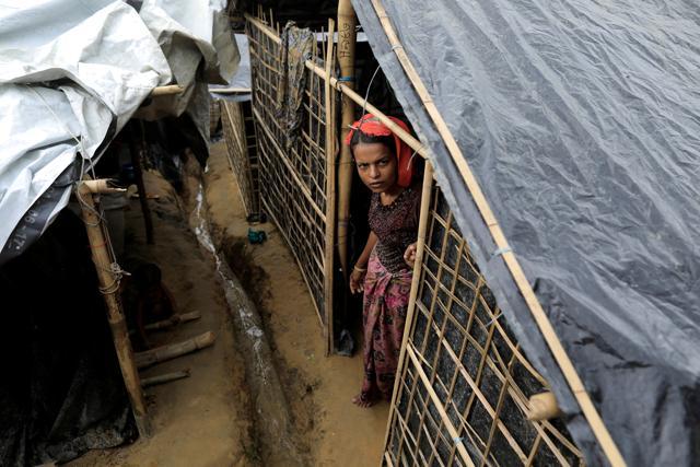 A Rohingya refugee looks out of her tent in Kutupalong Refugee Camp in Cox's Bazar, Bangladesh, on October 12, 2017. (Reuters) A Rohingya refugee looks out of her tent in Kutupalong Refugee Camp in Cox's Bazar, Bangladesh, on October 12, 2017. (Reuters)