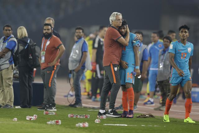 India's head coach Luis Norton de Matos hugs Rahim Ali after losing the FIFA U-17 World Cup match against Colombia in New Delhi on October 9. (AP) India's head coach Luis Norton de Matos hugs Rahim Ali after losing the FIFA U-17 World Cup match against Colombia in New Delhi on October 9. (AP)