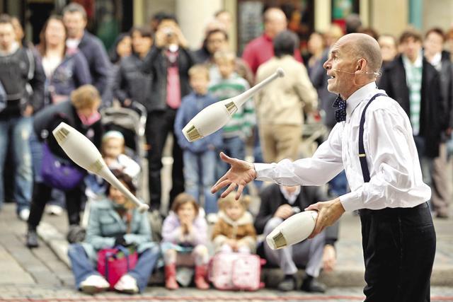 Be prepared to be enthralled by street performers while taking a stroll down Covent Garden in central London (Getty Images)