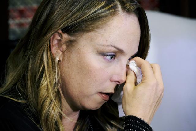 Louisette Geiss, an alleged sexual harassment victim of entertainment executive Harvey Weinstein, wipes a tear from her eye after talking at a news conference in Los Angeles on Tuesday. (AP)