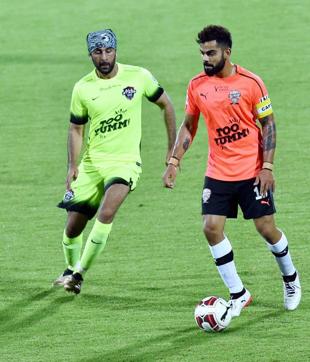 Virat Kohli vies for the ball with Ranbir Kapoor during the Celebrity Clasico 2017 match. (PTI)