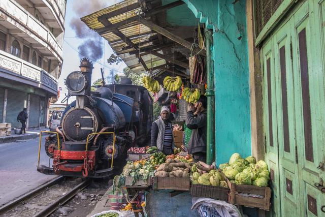 The toy train passing a market stand near Ghoom with only a few inches clearance. (Shutterstock) The toy train passing a market stand near Ghoom with only a few inches clearance. (Shutterstock)