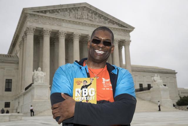 Bryant Johnson, personal trainer for Supreme Court Justice Ruth Bader Ginsburg, poses in Washington, with his new book. (AP) Bryant Johnson, personal trainer for Supreme Court Justice Ruth Bader Ginsburg, poses in Washington, with his new book. (AP)