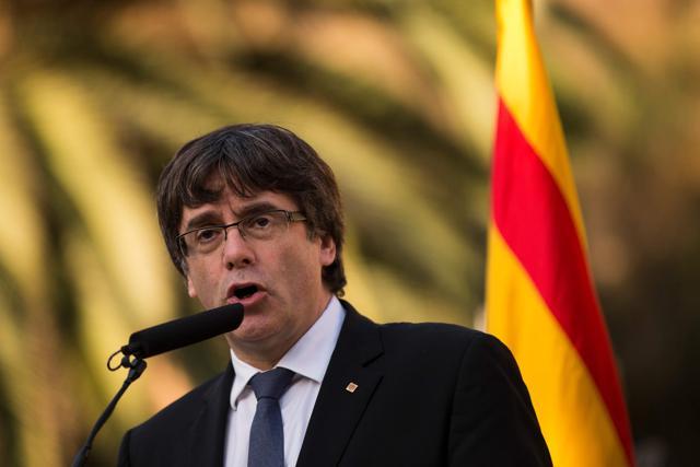 Catalan regional government president Carles Puigdemont delivers a speech on the sidelines of a wreath-laying ceremony commemorating the 77th anniversary of the death of Catalan leader Lluis Companys at the Montjuic Cemetery in Barcelona on October 15, 2017 (AFP) Catalan regional government president Carles Puigdemont delivers a speech on the sidelines of a wreath-laying ceremony commemorating the 77th anniversary of the death of Catalan leader Lluis Companys at the Montjuic Cemetery in Barcelona on October 15, 2017 (AFP)