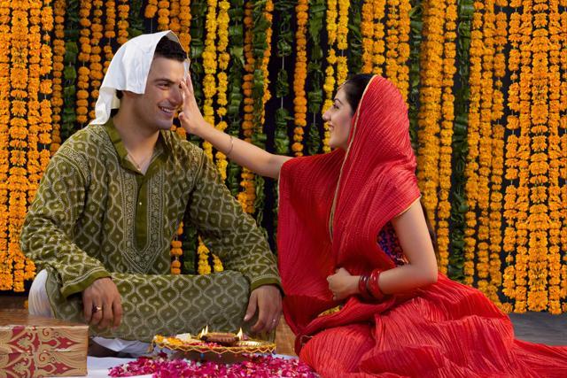 On this day, sisters pray for their brothers to have long and happy lives by performing Tika ceremony and brothers offer gifts to their sisters. (Shutterstock)