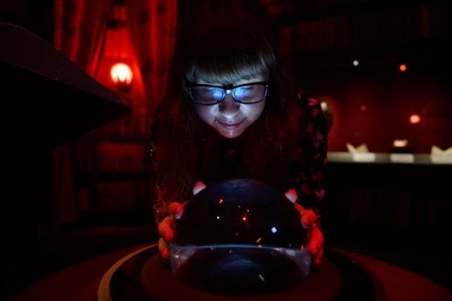 A visitor playing with an exhibit. A visitor playing with an exhibit.