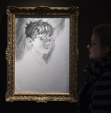A visitor stands next to a sketch titled The Boy who Lived. (AFP) A visitor stands next to a sketch titled The Boy who Lived. (AFP)