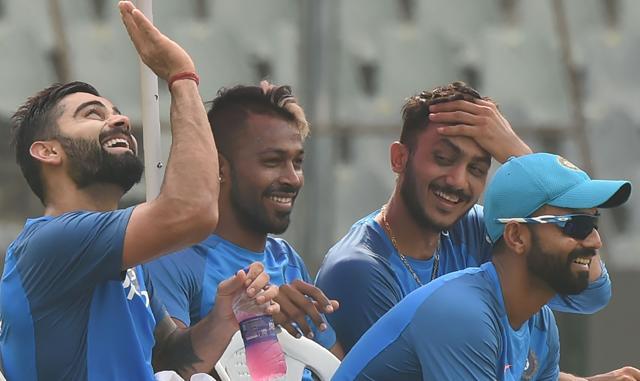 Indian captain Virat Kohli (L) and teammates Hardik Pandya (C), Ajinkya Rahane (R) and Axar Patel talk during a training session at the Wankhede stadium in Mumbai. (AFP) Indian captain Virat Kohli (L) and teammates Hardik Pandya (C), Ajinkya Rahane (R) and Axar Patel talk during a training session at the Wankhede stadium in Mumbai. (AFP)