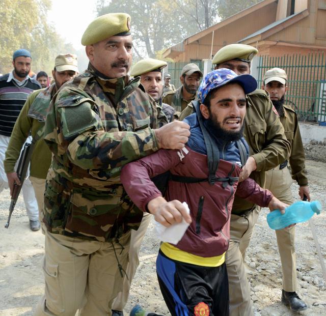Police arrest a youth during a protest against the growing incidents of braid chopping in Kashmir, in Srinagar on Saturday. (PTI) Police arrest a youth during a protest against the growing incidents of braid chopping in Kashmir, in Srinagar on Saturday. (PTI)