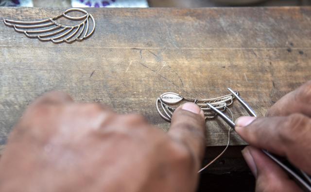 A goldsmith works in the creation of silver filigree jewellery, in Mompox. (AFP)