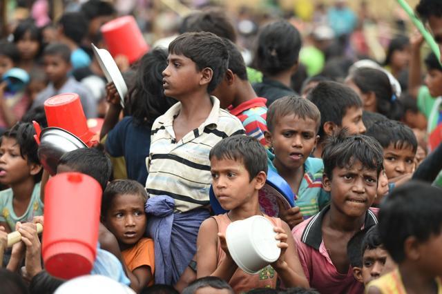 Rohingya Muslim refugees wait to receive food distributed by a Turkish aid agency at Thaingkhali refugee camp in Ukhia on October 21, 2017. (AFP) Rohingya Muslim refugees wait to receive food distributed by a Turkish aid agency at Thaingkhali refugee camp in Ukhia on October 21, 2017. (AFP)