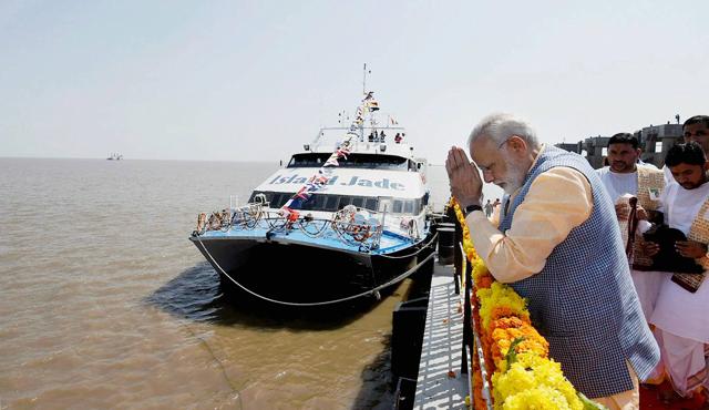 Prime Minister Narendra Modi prays at Ghogha Sea Ferry Point to mark the inauguration of the Ghogha-Dahej Ro-Ro ferry service, in Ghogha in Bhavnagar on Sunday. (PTI) Prime Minister Narendra Modi prays at Ghogha Sea Ferry Point to mark the inauguration of the Ghogha-Dahej Ro-Ro ferry service, in Ghogha in Bhavnagar on Sunday. (PTI)